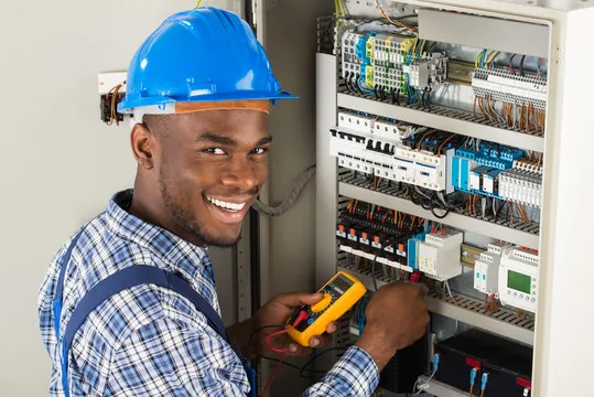 Certified electrician working on an electrical panel in Eket, Akwa Ibom