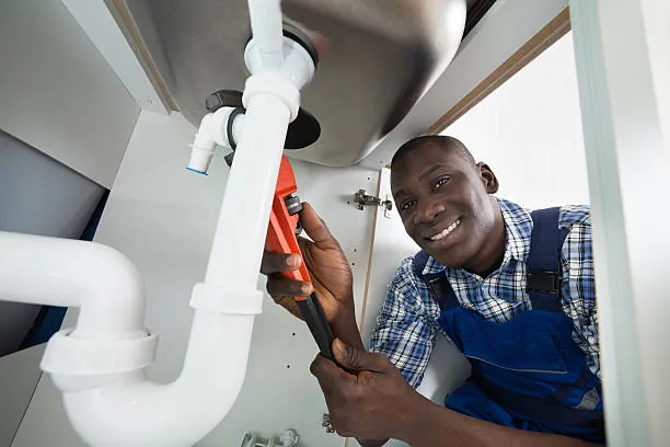 Professional plumber fixing a pipe in Eket, Akwa Ibom